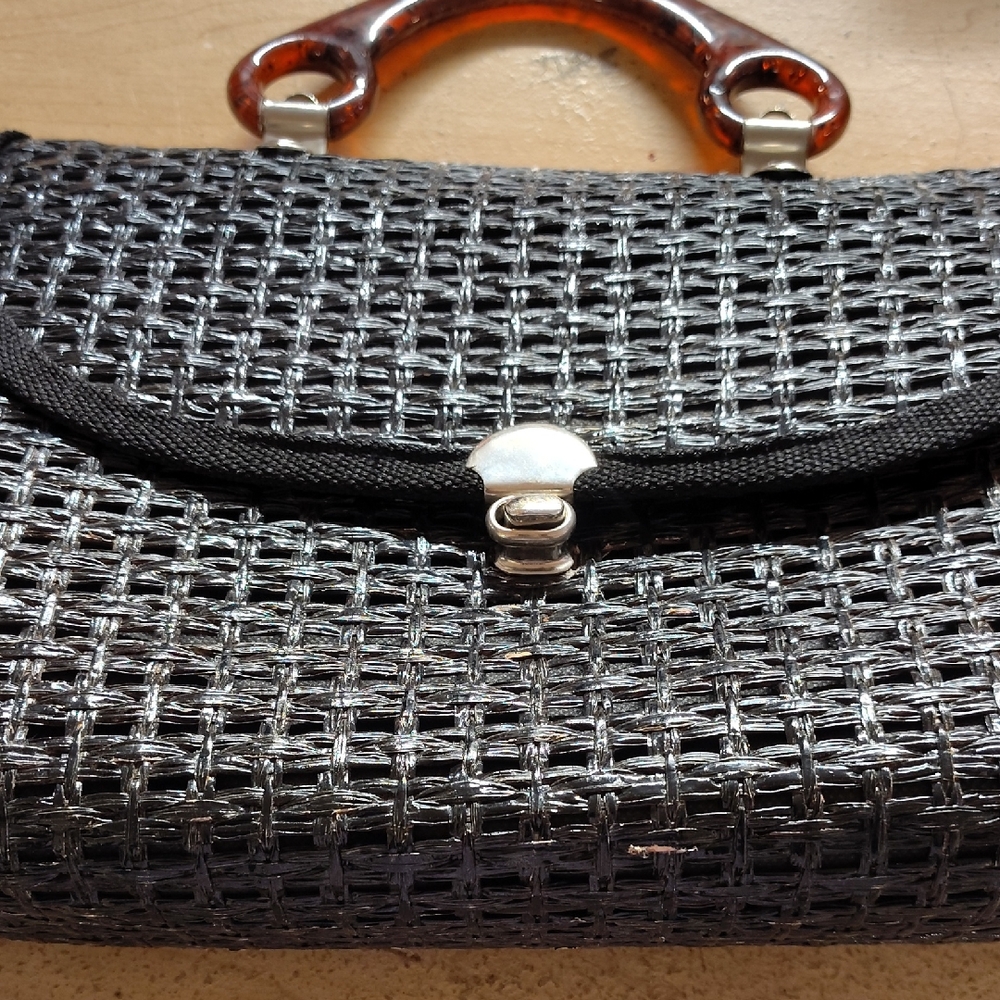 Elegant Black and Silver Woven Clutch with Brown Accents